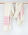 Pink colour with multiple stripes on a plain beige colour and knotted fringe and hand-twisted style on the stick.