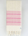 Folded pink colour with multiple stripes on a plain beige colour.