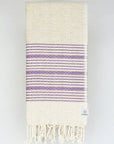 Folded purple colour with multiple stripes on a plain beige colour.