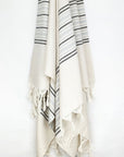 Grey stripes on a cream colour plain colour with linen & cotton blends with knotted fringe hanging.