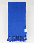 Folded 100% cotton scarf in plain blue colour.