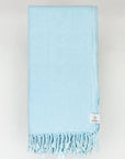 Folded 100% cotton scarf in plain ice blue colour.